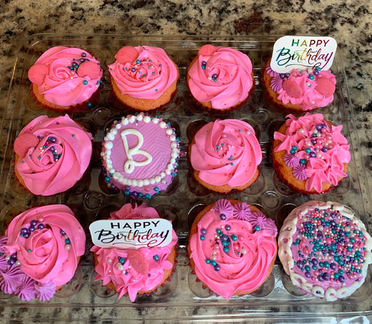 Beautifully decorated birthday cupcakes.